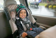 image-6 smiling infant in front facing car seat